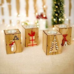 three wooden blocks with christmas decorations on them