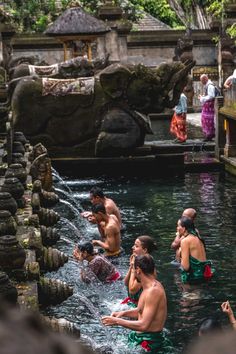 several people are bathing in the water