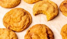 some cookies are sitting on a piece of parchment paper