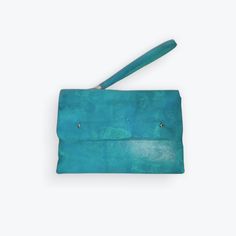 Expertly crafted and handmade, the Nicole Clutch Handbag is a sophisticated choice for any occasion. With its vibrant colors, woven sides, and silver-tone hardware, this clutch adds a touch of elegance to your outfit. The convenient wrist strap allows for easy and stylish carrying. Dimensions: 5.5 in. x 8.25 in. x 1.25 in. Formal Clutch With Leather Handles, Everyday Rectangular Clutch With Fold Over Clasp, Leather Clutch With Snap Closure And Rectangular Shape, Rectangular Clutch With Fold Over Clasp For Daily Use, Leather Clutch With Fold Over Clasp, Rectangular Clutch With Fold Over Clasp, Leather Handle Pouch Clutch For Evening, Rectangular Clutch With Magnetic Closure For Daily Use, Rectangular Clutch With Snap Closure For Travel