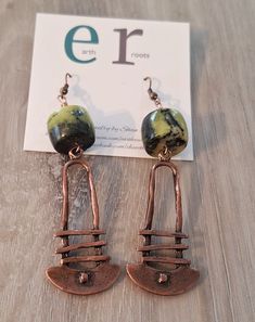 These boho style earrings feature abstract copper dangles with yellow turquoise gemstone beads. These earrings measure 3.5" in length.  They will ship in a gift box or bag via USPS with tracking info provided. Artsy Copper Drop Earrings, Artsy Copper Jewelry With Matching Earrings, Artsy Copper Dangle Earrings, Bohemian Jewelry With Copper Wire And Matching Earrings, Bohemian Brown Electroformed Earrings, Bohemian Brown Hand Forged Earrings, Green Bohemian Earrings With Copper Wire, Bohemian Green Earrings With Copper Wire, Bohemian Bronze Earrings With Copper Wire