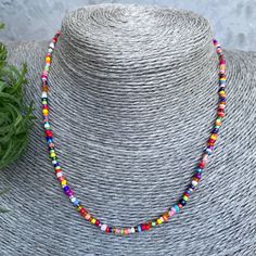 Buy a necklace handmade from beads. 🌟It is handcrafted on double thick line for durability and strength. 🌟The clasp is a carabiner clasp. 🌟The beads are tiny, each necklace is unique in its own way. It is possible to choose the length. 🎁 As a gift you get a storage bag :) Colorful Heishi Beads For Festival, Gift Choker With Spacer And Heishi Beads, Handmade Heishi Beads Choker As Gift, Handmade Heishi Bead Choker Perfect As A Gift, Adjustable Rainbow Beaded Necklace, Multicolor Letter Beads For Jewelry Making, Colorful Adjustable Heishi Bead Necklaces, Colorful Adjustable Heishi Beaded Necklace, Adjustable Beaded Necklace With Letter Beads For Festival