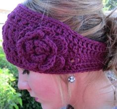 a close up of a woman wearing a headband