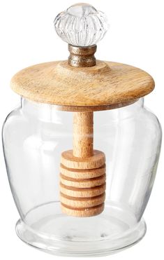 a glass jar with a wooden stopper in it