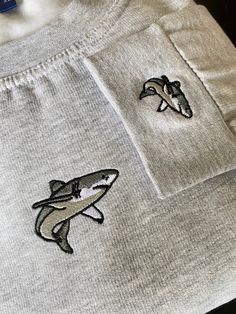 Embroidered 'Shark' Sweatshirt with matching embroidery on the left cuff! Our Sweatshirts are made of 50% Cotton and 50% Polyester - 300gsm Multiple sizes available from XS to XXXL Please check the size guide and thread colour choices are in the photos for you! Shark Hoodie Outfit, Hoodies Shark, Shark Gift Ideas, Embroidery Shark, Shark Clothes, Shark Embroidery, Shark Sweater, Shark Stuff, Comfy Christmas