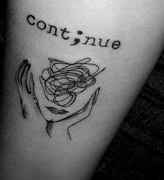 a tattoo that says continue on it