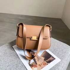 A fashionable and easy to match small square bag that doesn't pick people or seasons, and doesn't choose outfits. It easily adds points and brightens up your look.👍 Using comfortable cowhide fabric with clear patterns, the bag body appears full and three-dimensional, soft and skin friendly, showcasing an elegant temperament.👍 👍Fine leather, high quality accessories, and Adjustable length should strap. Dimensions:9.06inches length, 3.15cm wide, 5.91inches high Note： 1)If you have any questions, please contact me before placing an order. 2)Since all the items are made to order by hand, returns and exchanges couldn't be accepted. 3)Product dimensions are measured in kind and may have slight errors. 4)Due to factors such as lighting, environment, and display during shooting, there may be sl Trendy Square Box Bag For Travel, Trendy Square Shoulder Bag For Travel, Chic Satchel Shoulder Bag For Gifts, Trendy Square Baguette Bag, Classic Square Shoulder Bag With Single Strap, Trendy Large Capacity Rectangular Baguette Bag, Trendy Square Shoulder Bag For Daily Use, Square Baguette Bag For Daily Use, Chic Rectangular Flap Bag For Shopping