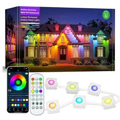 the remote control is next to an image of a house with colorful lights on it