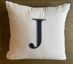 a pillow with the letter j on it