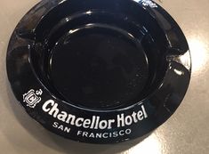 a black plate with the name chancellor hotel san francisco on it sitting on a table