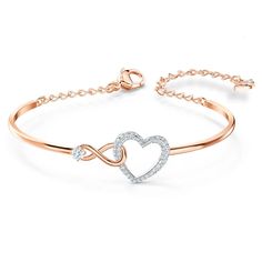 This heart bracelet combines the precision and quality of sparkling crystals with a chic rhodium plated chain, making this endearing look a cute accessory. A single white crystal adorns a dainty infinity sign interlaced with a dazzling white crystal pave heart, adding a brilliant and romantic touch to the simple, refined design. Teen Slang, قلادات متدلية, Heart Bangle Bracelet, Inexpensive Jewelry, Womens Bangles, Designer Bracelets, The Bangles, Swarovski Bracelet, Infinity Heart