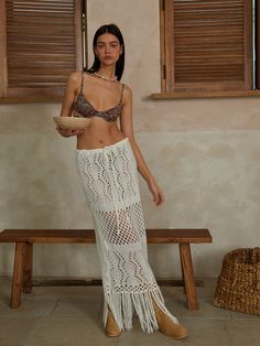 Editor's NotesThe Fringe-Hippy Long Skirt is a hippy-looking knit long skirt adding fringes on a diverse weave design, which you can wear as a cover-up. It can be worn freely with a knit strap on the waist, and with a relaxed fit, you can wear it from XS to L.- Maxi length- Fringe detail- Daily wear- A all-round item that is also good for styling with blouses or shirts for dress-up Measurements(in.)Size: One Size(XS-L)- Total Length: 36.61in. (Fringe Length 9.44in. / Skirt Length 27.16in.)- Waist: 18.11in.- Hem: 21.25in.Model Info: Height 5' 8, Bust 32in., Waist 23in., Hips 34.5in.                Composition & Care- Fabric: 100% Acrylic- Dry clean- Hand wash cold- Do not machine dry- Do not bleach- Do not warm iron Designer- b Fringe Beach Cover-up Bottoms, Beachwear Fringe Bottoms For Vacation, Beachwear Bottoms With Fringe For Vacation, Bohemian Long Skirt With Tassels For Summer, Long Beach Skirt With Tassels, Beach Long Skirt With Tassels, White Bohemian Bottoms With Fringe, Spring Beach Skirt With Fringe, Bohemian White Bottoms With Fringe