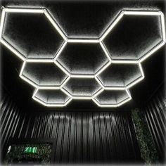 the inside of an elevator with lights on and in it's recessed ceiling