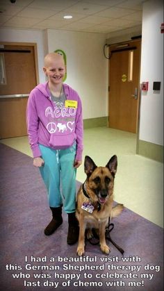 a person standing next to a dog on the floor