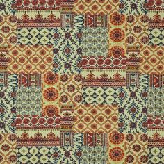 an orange and blue patchwork pattern on fabric