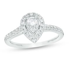 a pear shaped diamond ring on a white background