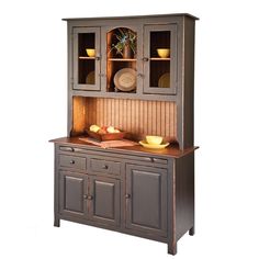 a wooden hutch with plates and bowls on it