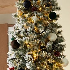 a decorated christmas tree with ornaments and lights