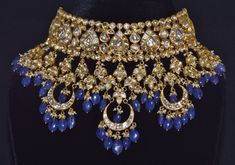 VINTAGE ASIAN LARGE 22K 18K GOLD TANZANITE, DIAMOND AND SEED PEARL CHOKER NECKLACE / EARRINGS SET !!THIS LISTING IS OF THE NECKLACE AND MATCHING EARRINGS!! GORGEOUS UNTREATED NATURAL DIAMONDS, NATURAL SEED PEARLS AND NATURAL TANZANITES EXTREMELY HIGH END - TOP QUALITY SET THIS IS AN ABSOLUTELY GORGEOUS LARGE BRIDAL CHOKER SET, STUDDED WITH NATURAL UNCUT DIAMONDS THROUGHOUT ACCENTED WITH HANGING GOLD LINKS / DROPS SET WITH MORE DIAMONDS. THE NECKLACE AND CHANDELIER EARRINGS HAVE BEAUTIFUL LARGE T Luxury Gold Kundan Necklace With Meenakari, Formal Yellow Gold Kundan Necklace With Meenakari, Yellow Gold Meenakari Jewelry For Reception, Luxury Gold Meenakari Bridal Necklace, Luxury Gold Jewelry With Meenakari, Luxury Gold Meenakari Jewelry, Luxury 22k Gold Jewelry For Festive Season, Luxury 22k Gold Festive Jewelry, Opulent Gold Jewelry For Reception