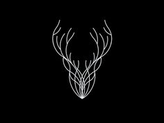 a white deer's head with long horns in the middle of it on a black background