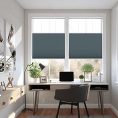 a computer desk sitting in front of two windows with blinds on the window sill