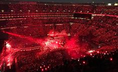 a large stadium filled with lots of red lights