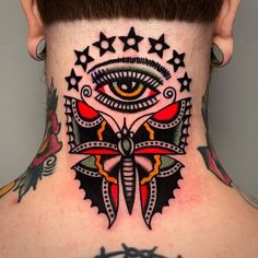 a man with a neck tattoo that has an eye and stars on it