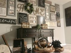 a living room filled with furniture and pictures on the wall