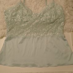 Beautiful Soft Blue Undergarment, Could Be Worn Under Jacket Or Sweater, Sweet Style Spaghetti Straps Lace Front And Top, Body Of The Cami Is A Silky Stretch Fabric. It Is Really Pretty. Euc - Never Worn Fits Med-Large Depending On Chest Size. Lace Camisole Top For Loungewear, Blue Tank Camisole For Loungewear, Fitted Light Blue Spaghetti Strap Top, Elegant Blue Fitted Camisole, Blue Lace Camisole For Spring, Blue Tank Camisole For Party, Chic Light Blue Cami Tank Top, Light Blue Spaghetti Strap Top, Elegant Fitted Blue Camisole