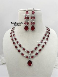 Double layer American Diamond Necklace Set / CZ Necklace/Indian Jewelry/ Reception Jewelry/ Bollywood Jewelry/ Silver red/ 2 two tier necklace  All items are shipped from Brampton, Ontario, Canada. If you need your item by a certain day, please reach out to us for express delivery option so that we can update the shipping for you. We kindly request to consider minor variations in colors, shades, textures as pictures displayed may slightly vary from the actual product due to digital image limitations.Please expect the possibility of some minor imperfections when buying handmade jewelry. Please contact us for any questions you might have. Thank you and Happy shopping 😊 Red Ruby Necklace For Anniversary, Double Strand Red Jewelry For Party, Red Double Strand Jewelry For Party, Red Double Strand Party Jewelry, Red Double Strand Necklace For Party, Indian Jewelry Silver, American Diamond Necklace Set, Brampton Ontario, American Diamond Necklaces