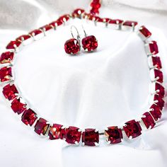 This is a beautiful tennis necklace that has that rich red garnet color. These crystals are AAA vvs1 cushion cut garnet cubic zirconia. They sparkle and are intricately cut exactly like the gem stone. Absolutely Elegant. Regal Jewelry Cushion Cut Ruby Jewelry Gift, Cushion Cut Ruby Jewelry For Gift, Cushion Cut Ruby Jewelry As Gift, Cushion Cut Crystal Jewelry Gift, Red Cushion Cut Gemstone Jewelry, Red Necklace With Prong Setting For Wedding, Red Prong Set Necklace For Wedding, Red Wedding Necklace With Prong Setting, Red Cushion Cut Ruby Jewelry