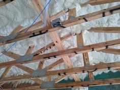 the ceiling is being constructed with wooden beams