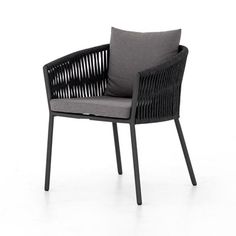 an outdoor chair with grey cushions and black metal frame, on a white background the chair has a dark gray cushion