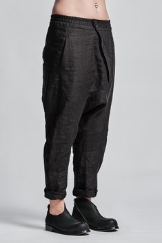 "Denim Drop Crotch Boiled Linen Trousers With Elastic Waistband__ // EXPRESS DELIVERY ONLY __Cropped Length __Asymmetrical Hidden Front Closure __Rear Bonded Panel __2 Front & 2 Rear Pockets __Elastic Waistband __Fully Completed Stitching model__ bust 92 (36\"), waist 72 (28\"), hips 102 (40\"), biceps 28 (11''), height 177 (5'8\"), kg 65 (143 lbs) model wears size M | color: black fabric__ 100 linen care__ dry cleaning do not bleach do not tumble dry do not iron to keep wrinkle effect sizin Black Tapered Bottoms For Spring, High-waist Linen Bottoms With Side Pockets, High Waist Linen Bottoms With Side Pockets, High Waist Black Linen Pants, Baggy Linen Trousers, Black Linen Tapered Leg Bottoms, Black Linen High-waisted Pants, Black High-waisted Linen Pants, Fitted Black Linen Bottoms