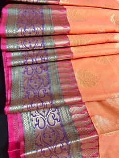 Premium Quality Cotton Silk Saree in Light Peach color with Banarasi borders. Item: SareeColor : Peach with Pink, Green adn Purple on the Border and Green Pallu Base Fabric: Soft Cotton Silk Blouse piece : Comes with Blouse piece.Blouse material: Cotton Silk Fall & Edging: (Yes/No) : YesDisclaimer -:- Color variation is possible due to various reasons like phone or desktop setting, resolution etc. Please don't hold us responsible. Our aim is to put the exact color of the Saree.- If the Saree is Semi-stitched Peach Traditional Wear With Self Design, Bollywood Style Peach Traditional Wear With Self Design, Festive Peach Traditional Wear With Self Design, Peach Zari Work Traditional Wear For Festivals, Peach Traditional Wear With Zari Work For Festivals, Peach Traditional Wear For Navratri With Self Design, Festive Peach Traditional Wear With Zari Weaving, Peach Traditional Wear With Self Design, Peach Traditional Wear With Traditional Drape