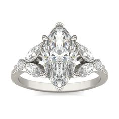 a pear shaped diamond engagement ring with three pears on the band and side stones