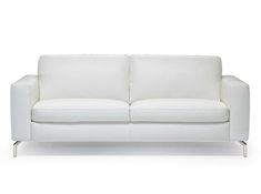 a white couch sitting on top of a white floor