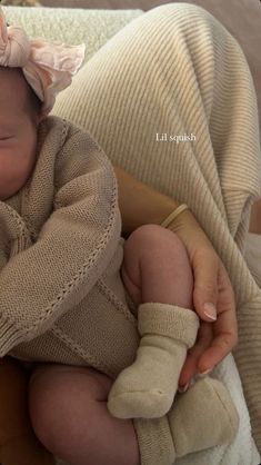 a newborn baby is wrapped in a blanket