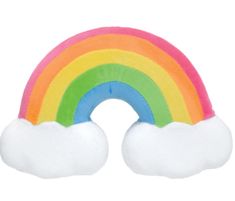 a rainbow shaped pillow sitting on top of a white cloud