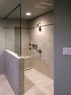 a walk in shower sitting inside of a bathroom