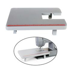 a sewing machine with a white background and red line on the bottom half of it