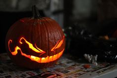 a carved pumpkin sitting on top of a table