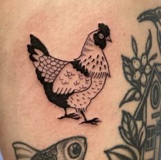 a chicken and fish tattoo on the thigh