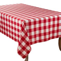 a red and white checkered tablecloth with wooden wheels