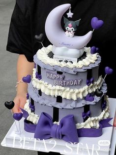 a person holding a birthday cake in their hands