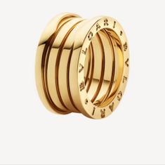 Distinctive Spiral Is A Metaphor For The Harmony Of Past, Present And Future - Reflected In The Magnificence Of The Eternal City - And The Emblem Of The Pioneering Spirit Of The Collection. B.Zero1 Four-Band Ring In 18kt Yellow Gold. Bvlgari Four-Band Ring Polished 18-Karat Yellow Gold Spiral Center With Engraving At Sides Made In Italy Bulgari Gold Ring, Bvlgari Gold, Bvlgari Ring, Bulgari Jewelry, Bvlgari Jewelry, Ceramic Rings, Gold Band Ring, Diamond Rings Bands, Pink Ring