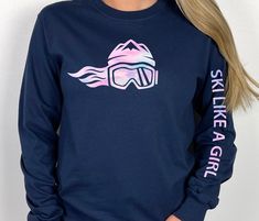 Our girls long sleeve cotton candy ski t-shirts are absolutely perfect for every ski girl on the go. Whether you’re taking it easy on the bunny slopes, bombing down a black diamond, or simply hanging with your friends between classes, this 100% cotton Ski Like A Girl long sleeve ski t-shirt provides style and fun, while also offering a lightweight warmth that is soft and perfectly fitted. Long Sleeve Ski Tops For Ski Season, Long Sleeve Skiing Tops For Ski Season, Long Sleeve Tops For Ski Season And Winter Sports, Long Sleeve Tops For Ski Season, Pink Graphic Print T-shirt For Winter, Winter Pink Graphic Print T-shirt, Cotton Candy Design, Cotton Candy Colors, Ski Girl