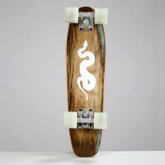 a skateboard with an image of a snake on the front and bottom part of it