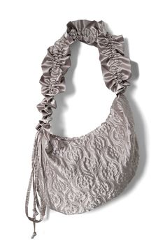 a white purse with ruffles on it