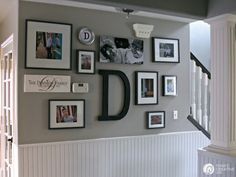 there is a wall with many pictures on it and the letters d are in black and white